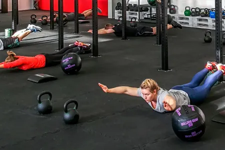 People train on WARCO fitness flooring in the fitness studio