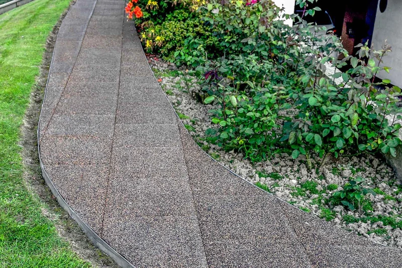 It is also easy to create a curved garden path with square slabs.