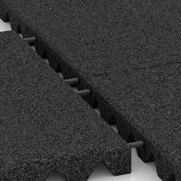 Großaufnahme vom Verbindungssystem von WARCO-Boden 0660 - Gumová dopadová dlaždice na dětské hřiště im Farbdesign Antracit. Abmessungen 500 x 500 x 45 mm.