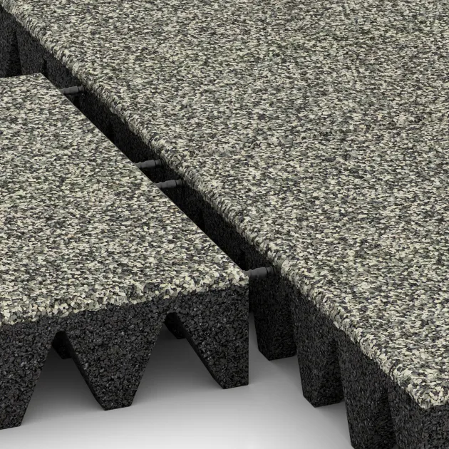 Großaufnahme vom Verbindungssystem von WARCO-Boden 5645 - Bezpečnostní dlaždice na dětské hřiště 10 cm - EN 1177 ≤ 300 cm im Farbdesign Světlý granit. Abmessungen 500 x 500 x 100 mm.