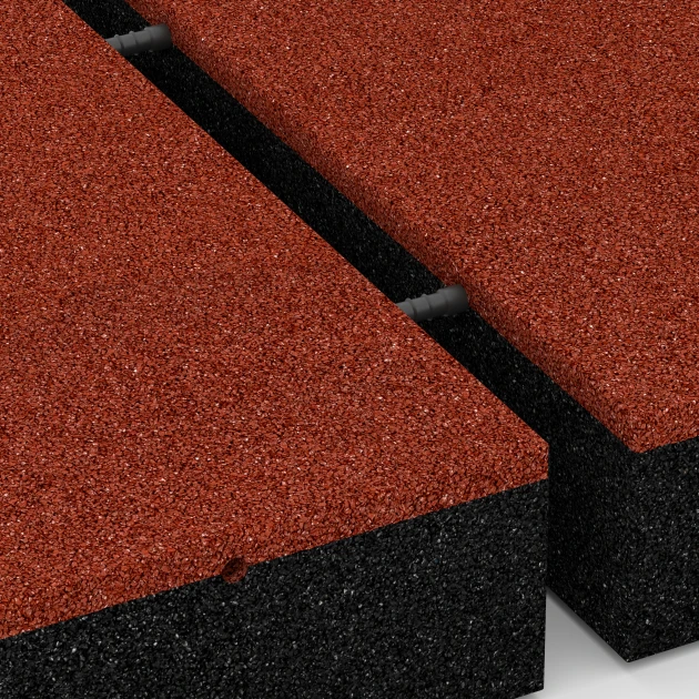 Großaufnahme vom Verbindungssystem von WARCO-Boden 6278 - Tlumicí deska – 300 cm im Farbdesign Cihlově červená. Abmessungen 50 x 50 x 11 cm.